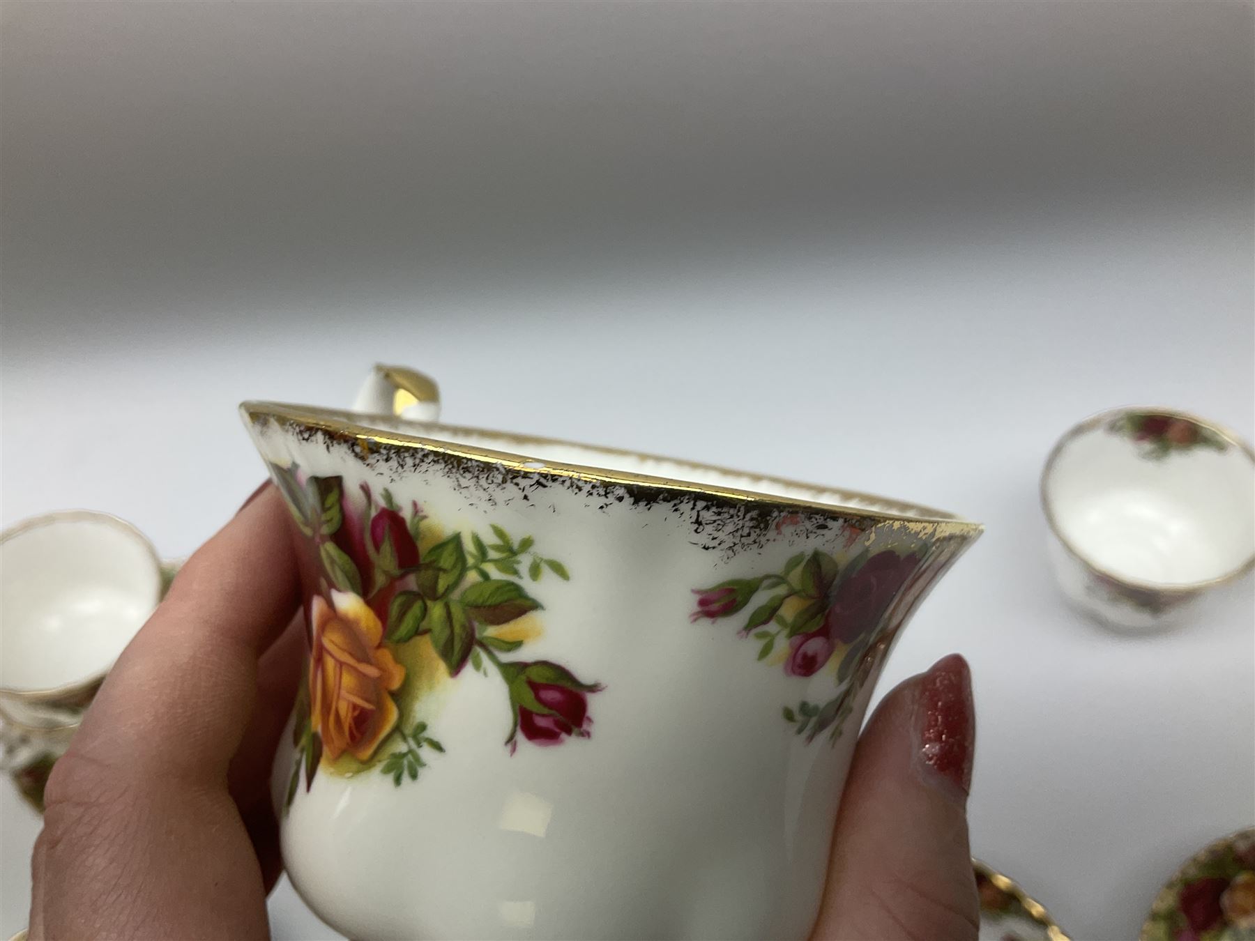 Royal Albert Old Country Roses pattern tea set, comprising teapot, coffee pot, six teacups and six saucers, five side plates, further teacup with joined saucer and side plate, open sucrier, milk jug, cake plate, and preserve pot and cover, together with Royal Albert Jubilee Rose pattern sauce boat and stand, and Royal Albert Lavender Rose pattern cake stand. 