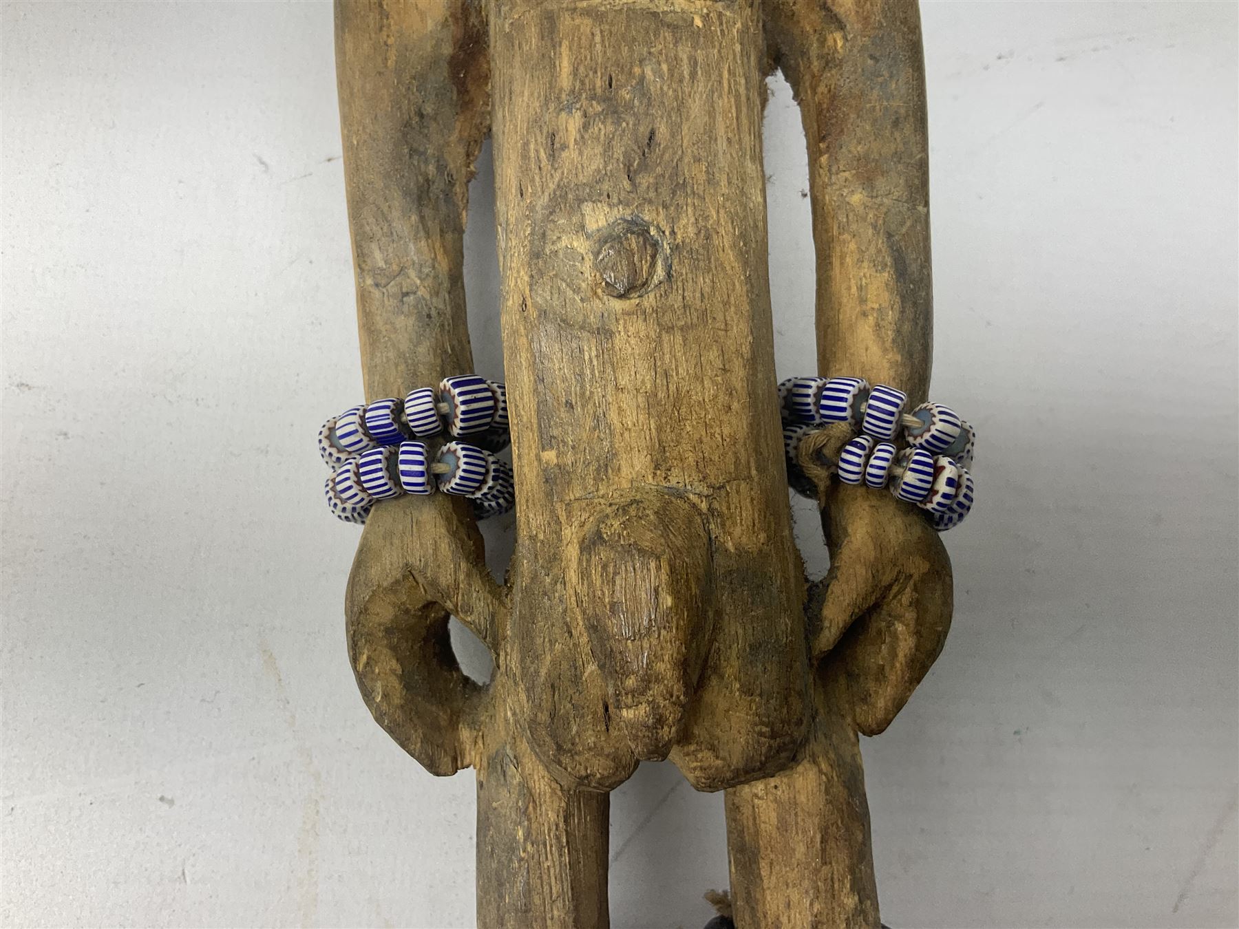 Early 20th century West African Yoruba family wooden figure of Orisha Oko, the god of farming/agriculture, carved from the solid, bears manuscript label of provenance verso H26.5cm