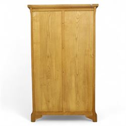 Old Charm - 'Chatsworth' light oak bookcase with two cupboards, featuring two fixed horizontal shelves forming six  rectangular open compartments, over twin panelled cupboard doors, chamfered uprights and plinth base