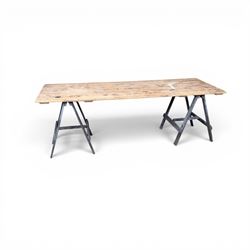 Vintage wooden plank trestle table, on two painted folding stands