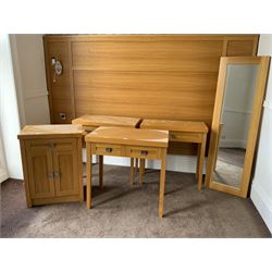 Three light oak side tables, two door cupboard and wall mirror- LOT SUBJECT TO VAT ON THE HAMMER PRICE - To be collected by appointment from The Ambassador Hotel, 36-38 Esplanade, Scarborough YO11 2AY. ALL GOODS MUST BE REMOVED BY WEDNESDAY 15TH JUNE.