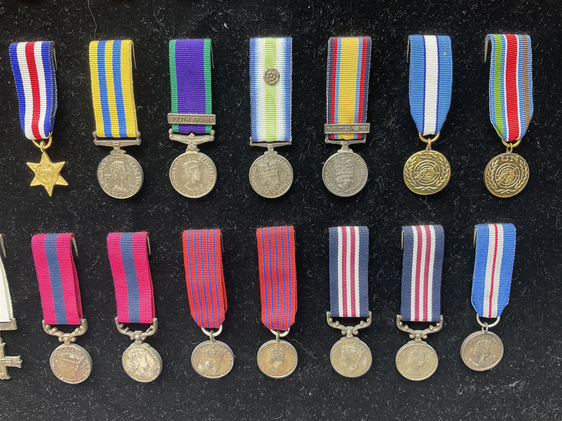 Two limited edition large framed display boards with half-size copies of British Gallantry and Campaign Medals produced by Danbury Mint and entitled 'For Valour'. Sixty medals on each board, all with ribbons. Complete with Danbury Mint certificate serial number A0148 and other paperwork.