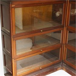 Globe Wernicke - early 20th century corner bookcase, comprising six sections, panelled sides raised on a moulded plinth base  