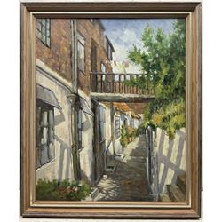 Donald Gray Midgely (British 1918-1995): Street in Robin Hood's Bay, oil on board signed and dated '75, 55cm x 45cm