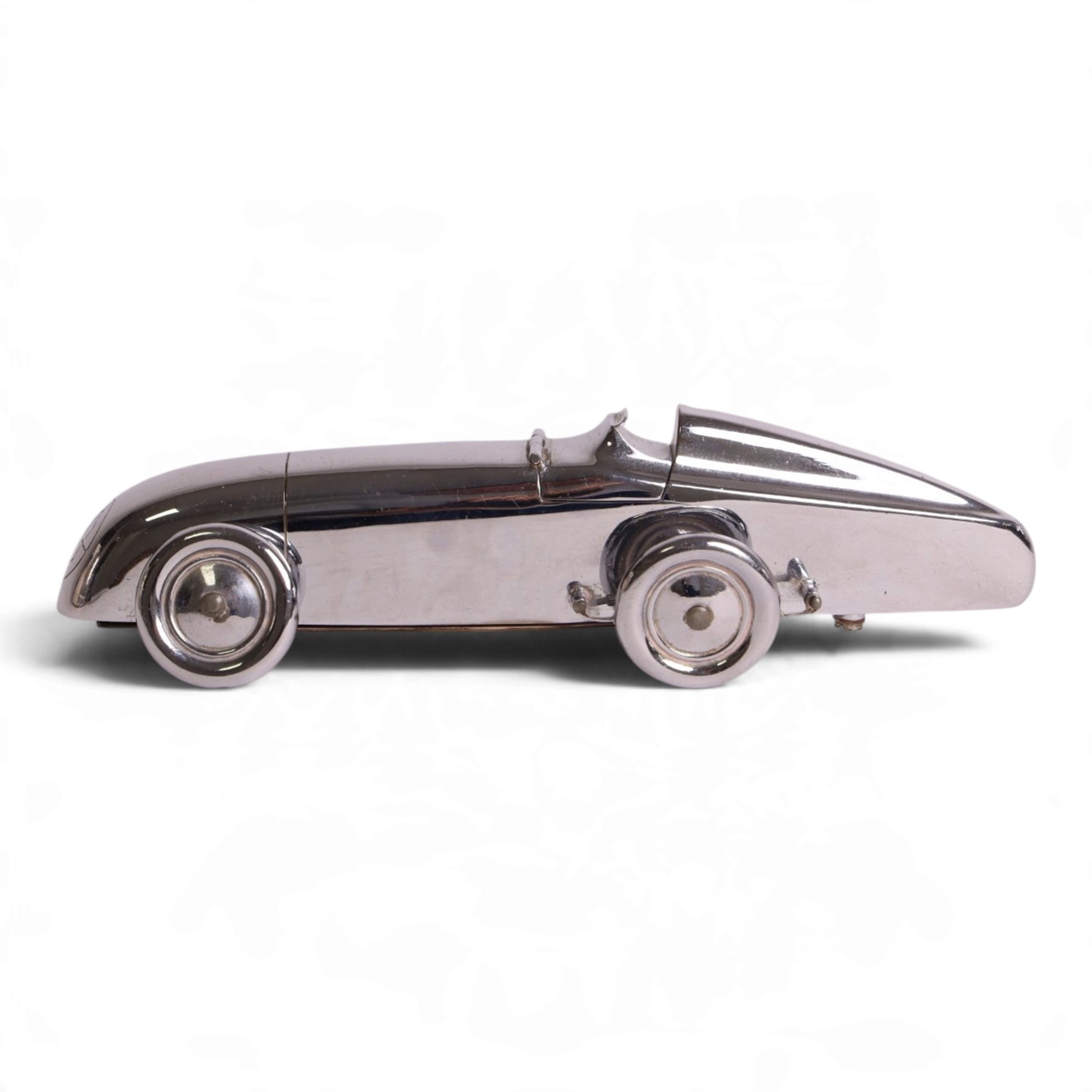 MG Magic Midget table lighter, circa 1933, chrome plated, engraved to the nose and on one side, marked beneath 'S&M, Made in England, Pat. no. 373219' 