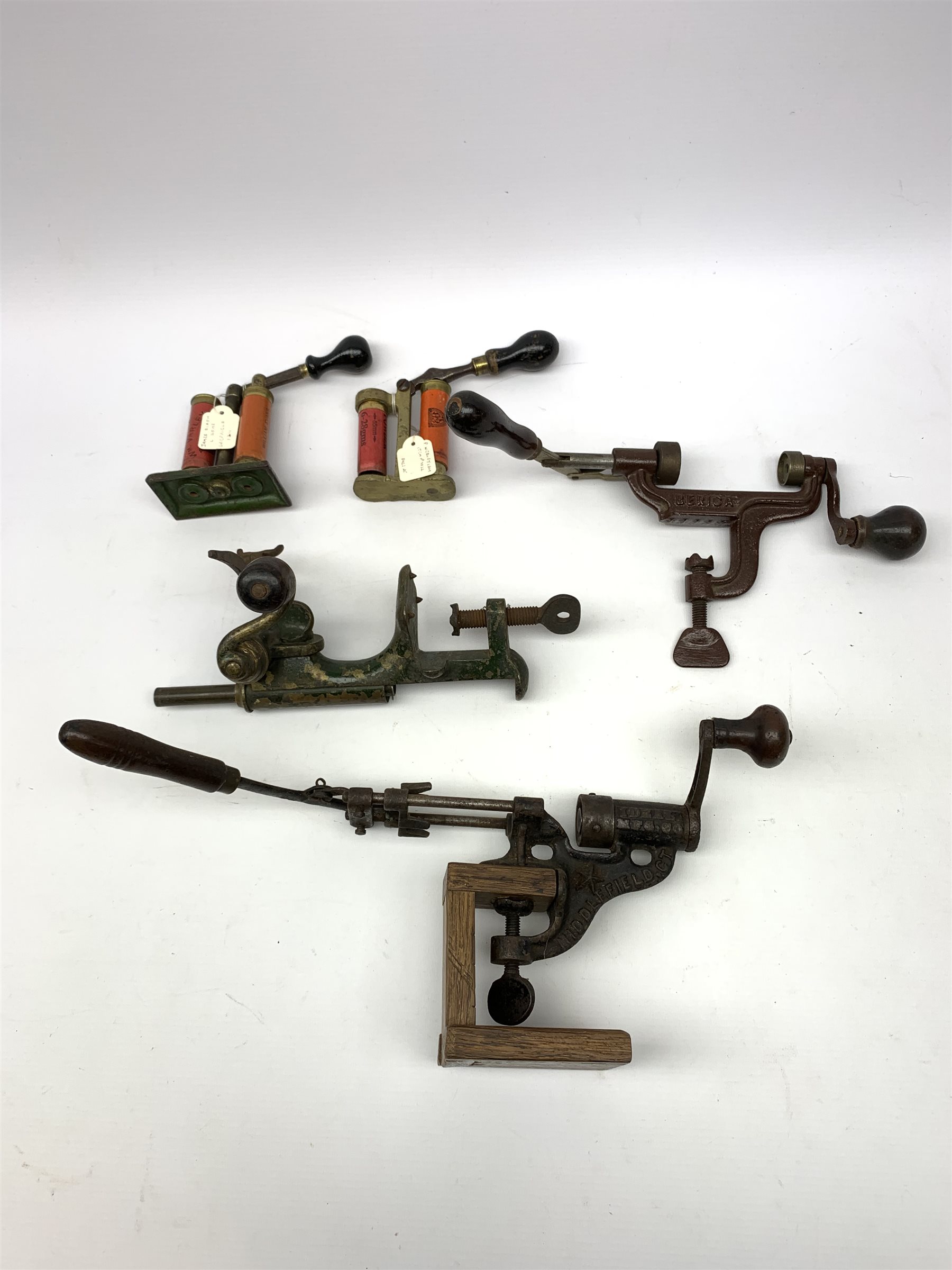 19th century and later predominantly 12-bore cartridge making equipment including American Ideal Mfg. Co. Middlefield Ct. re-loader, unmarked brass re-loader, Berica crimper, James Dixon and Webley recappers, Wm. Powell & Son Birmingham oil bottle, turned wooden rammer etc; and green metal cartridge carrying case