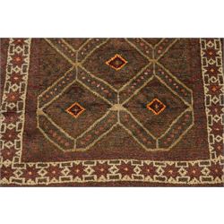 Two hand-knotted rugs, comprising Persian medallion rug and tribal rug, Persian hand-knotted rug, ivory ground centred by shaped floral medallion with pendants, surrounded by stylised flowerheads and foliate motifs, enclosed by multiple floral and geometric borders, H155cm, W123cm; tribal hand-knotted rug, dark brown ground with repeating linked geometric diamond medallions in orange and green, enclosed by ivory geometric border, striped ends with fringes, H150cm, W71cm