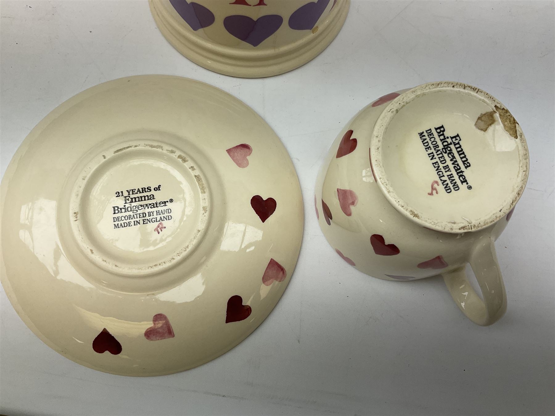 Collection of Emma Bridgewater spongeware ceramics, to include Pink Hearts pattern teapot, milk bottle vase, teacup and saucers, Love & Kisses sugar shaker and large 'I love you more than Marlon Brando' mug, British Birds and Black and White pattern mugs, etc, all with printed marks beneath, tallest H21.5cm
