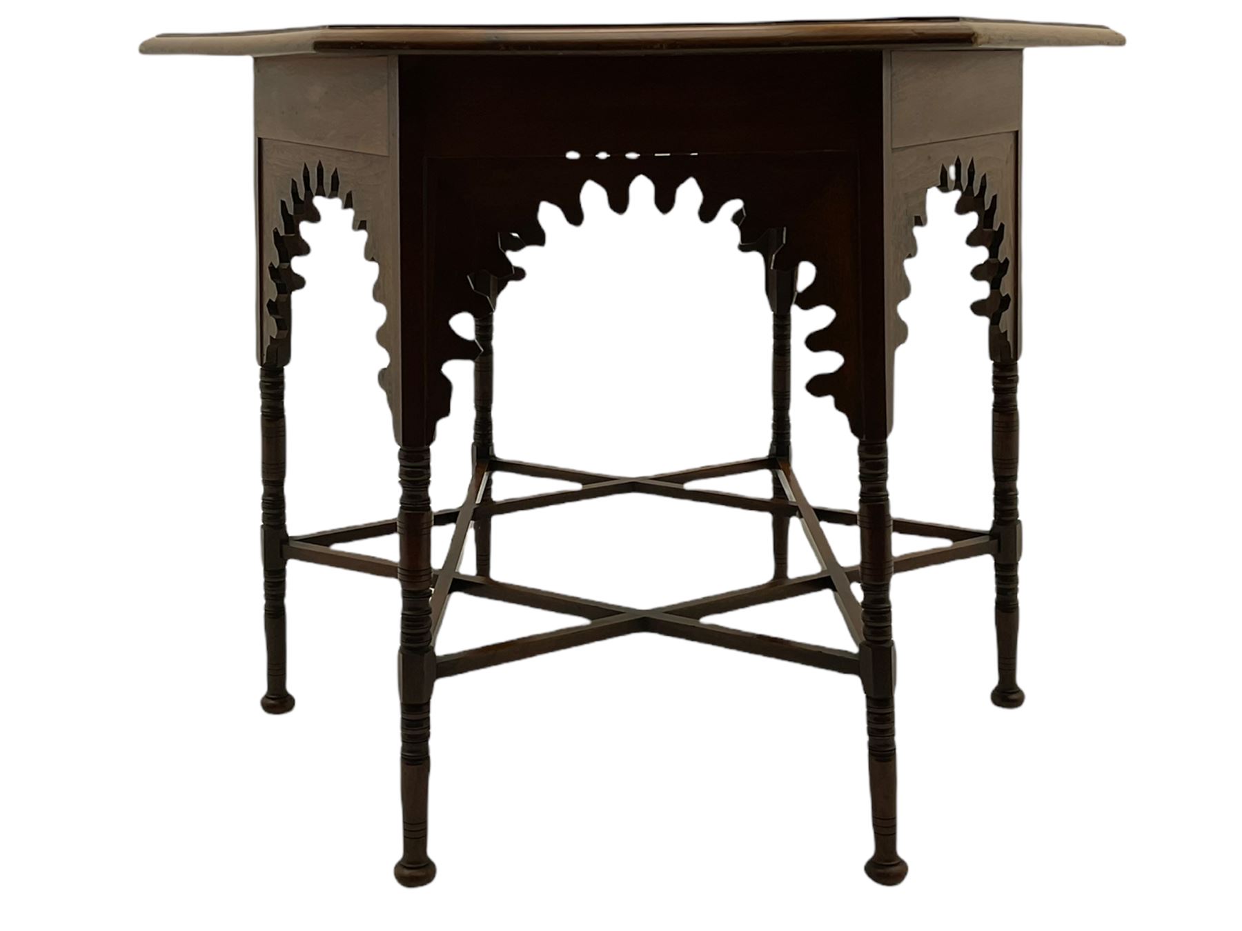 Liberty & Co circa 1890 - walnut centre table, hexagonal form, fretwork frieze, star stretcher base, turned supports on button feet. Stamped on underside.
Featured in - Pictorial Dictionary of British 19th century Furniture Design, Daryl Bennett Liberty's Furniture, 1875-1915, The Birth of Modern Design.
Liberty Style, The Classic Years, 1898 - 1910, by Mervin Levy.