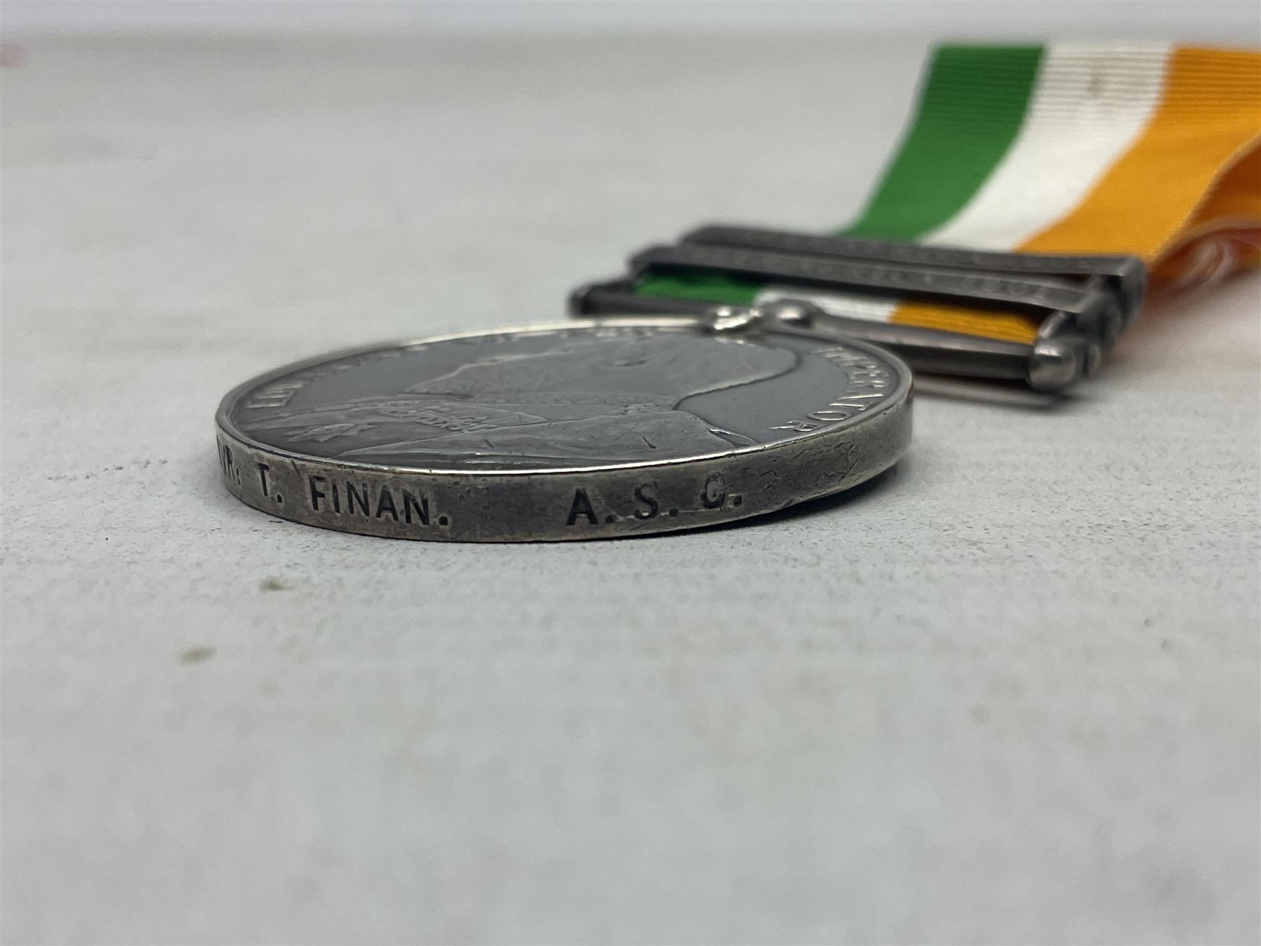 Boer War pair of medals comprising Queens South Africa Medal with two clasps for Paardeberg and Relief of Kimberley and Kings South Africa Medal with two clasps for South Africa 1901 & 1902, awarded to 9752 Dvr. T. Finan A.S.C. with ribbons (2)
