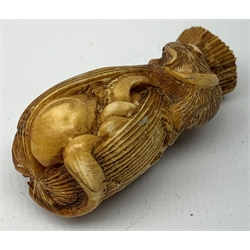 Japanese Meiji carved ivory okimono or seal, modelled as an octopus and fish in a net, with rat seated on top, H5cm   