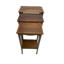 Waring & Gillow - nest of three mahogany occasional tables, rectangular crossbanded top with ebony stringing, raised on tapered supports united by stretcher, the smallest with undertier