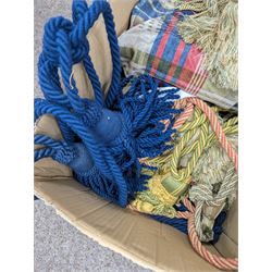 Collection of curtain fabric pieces and tassels