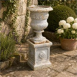 Victorian weathered heavy ornate cast iron garden centerpiece urn, distressed white and du...
