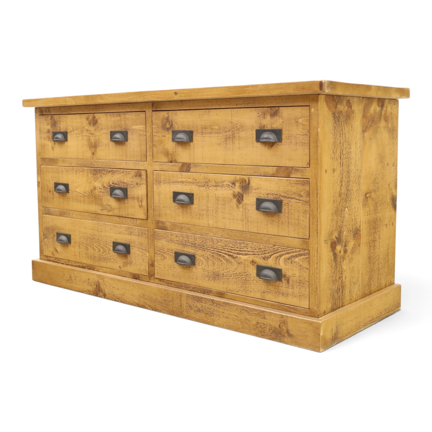 Indigo Furniture - large rustic oak chest, rectangular top fitted with six drawers with metal pull handles, on skirted base