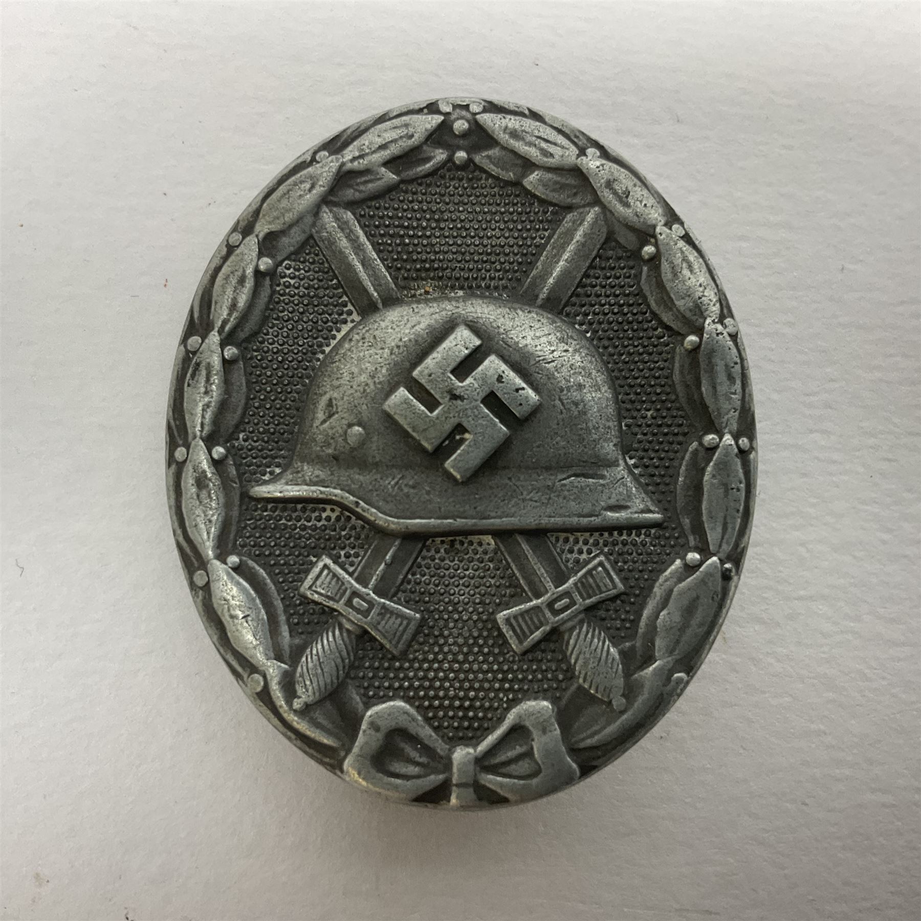 Three WW2 German wound badges - two 'silver' and one bronze with traces of silvering (3)