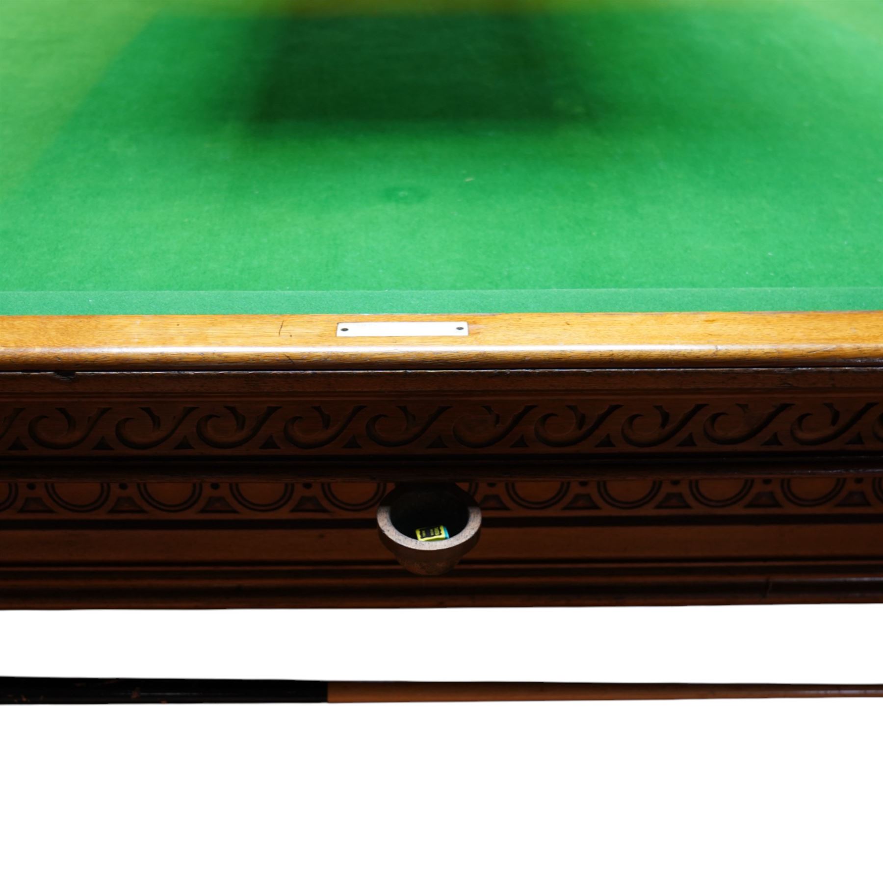 An outstanding bespoke late Victorian Aesthetic Movement golden oak full-sized snooker table of gothic influence, the rectangular slate bed covered in green baize within moulded rails and rounded pocket mounts, the protruding frame decorated with blind-fretwork frieze panels of Vitruvian scrolls and geometric ornament, over rails of repeating roundel carvings, raised on square chamfered and reeded supports with carved detail and panelled reserves, with further stylised brackets, stamped to the underside on all four edges R Anderson, serial number 4337
Viewing in situ near Tadcaster, please contact Chloe to arrange - 01904 393300