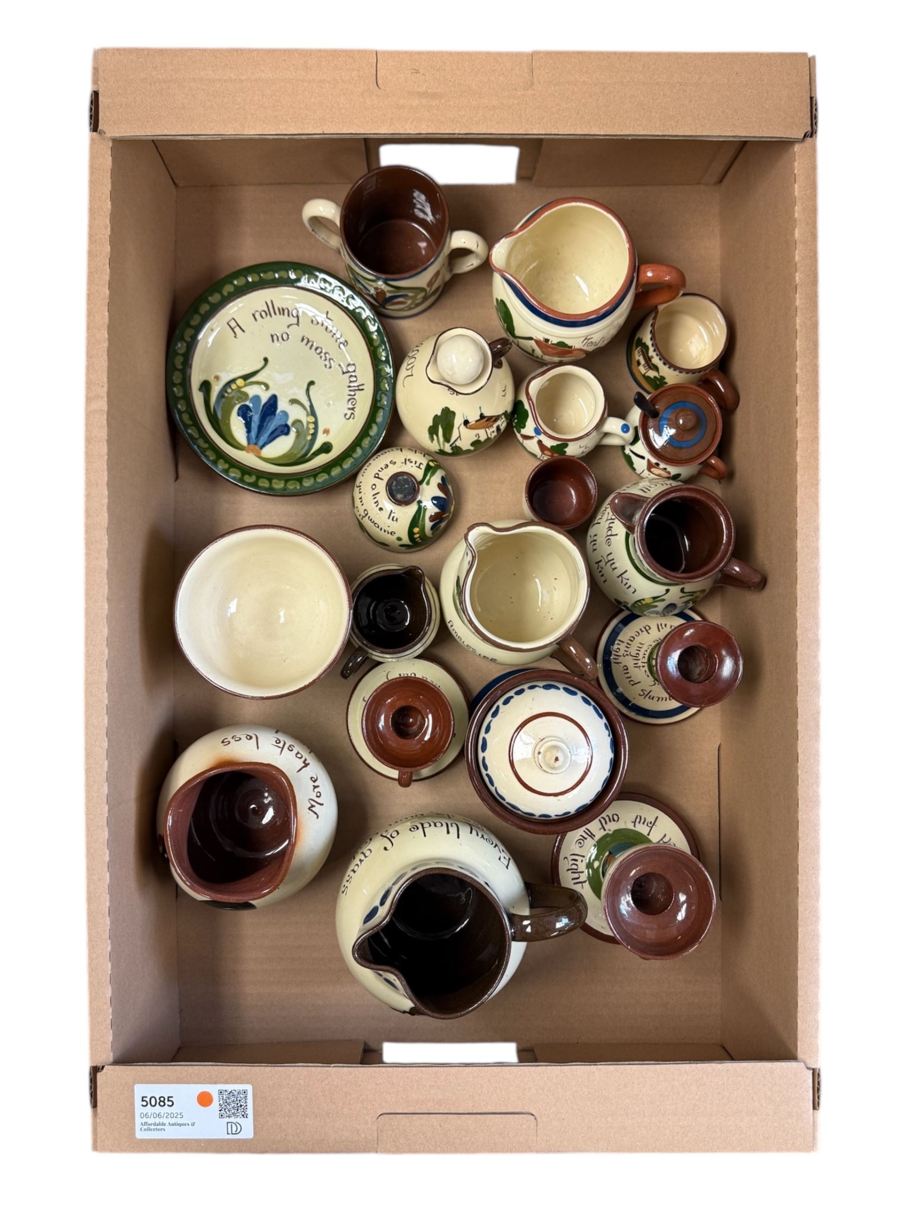 Collection of Torquay and similar Motto ware, including jugs, candlesticks, twin handled mug etc 