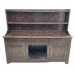 Bylaws of Leominster - 18th century design figured oak dog kennel dresser, the raised plate rack with projecting cornice over hooks and three tiers, moulded rectangular top over three drawers and two panelled cupboards, moulded frame and panelled sides, on stile supports