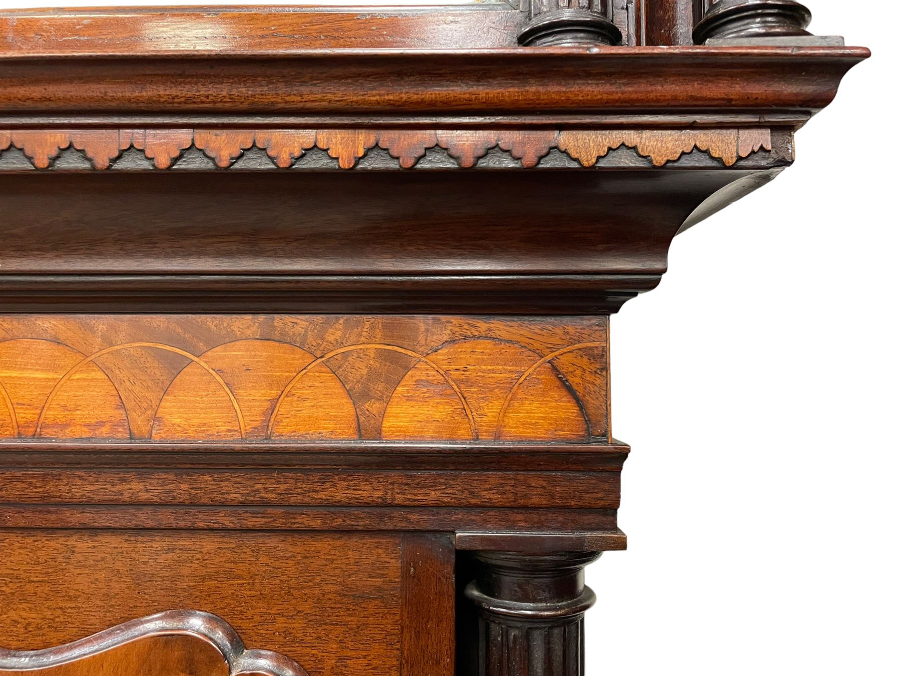 Penlington of Liverpool – early 19th century 8-day mahogany longcase clock, swans neck pediment with three turned wooden finials and verre eglomise panels, trunk with reeded columns and wavy topped door, plinth with canted corners on bracket feet, painted break-arch dial with Roman numerals and five-minute Arabic’s, centre sweep calendar and seconds hands, blue steel serpentine hands, signed beneath a painted rolling moon in the arch PENLINGTON, LIVERPOOL, eight day four pillar movement, anchor escapement and rack striking on a bell. With pendulum and weights.  The Penlington family were prolific clockmakers in 19th century Liverpool working from several addresses in the city, also recorded as chronometer and chronograph makers.