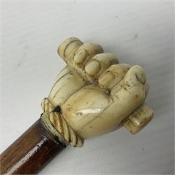 19th century malacca walking cane with scrimshaw handled in the form of a clenched fist holding a scroll, H86cm 