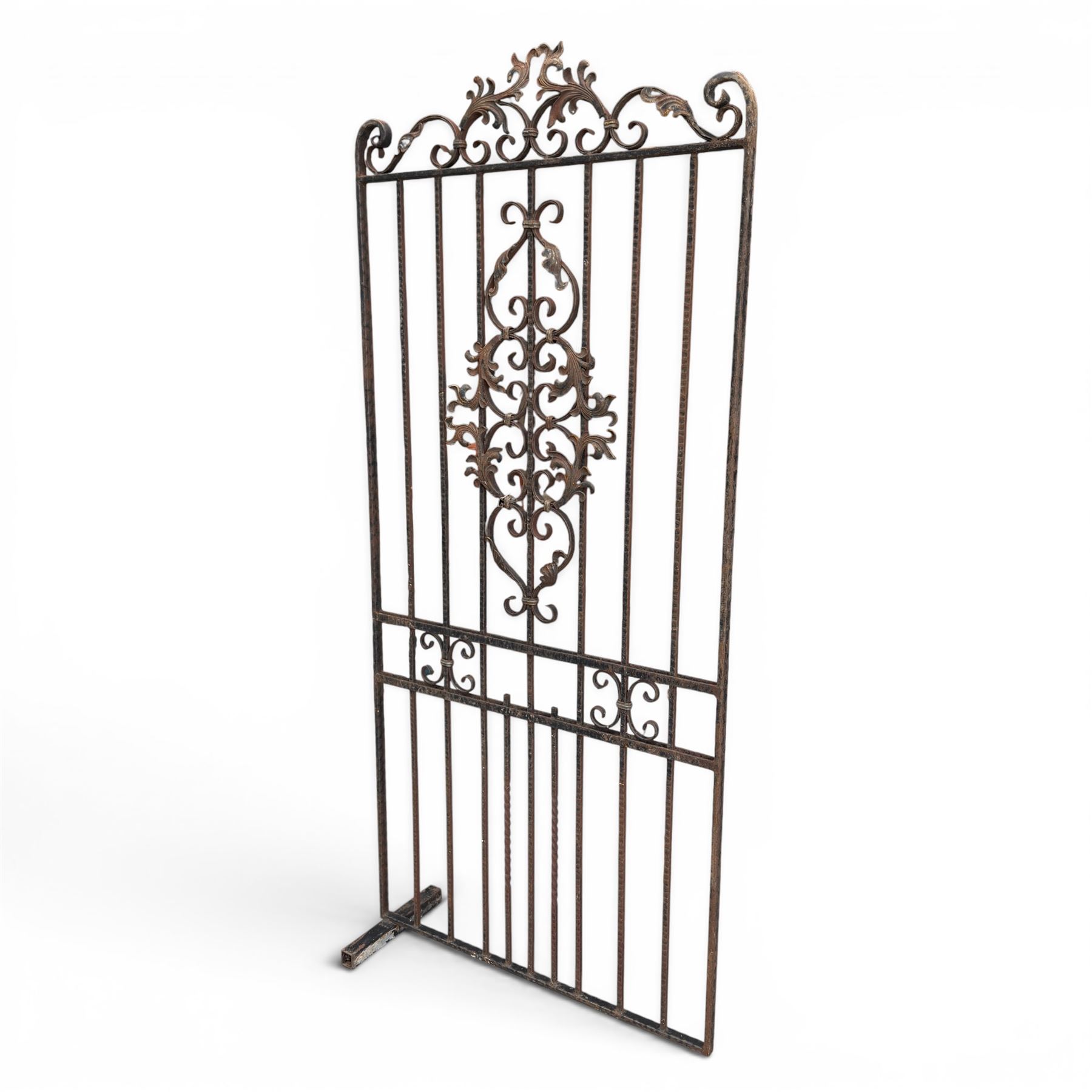 Victorian wrought iron vineyard gate, with ornate scrollwork and foliate acanthus leaf decoration, shaped cresting and central decorative panel, finished in rustic black painted finish