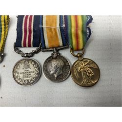 George V Military Medal and Distinguished Conduct Medal miniature group of seven medals comprising MM, DCM, WW1 trio including 1914 Star with date clasp and MID leaves, The Great Durbar Delhi 1911 Medal and LSGC; on pinned wearing bar; WW1 Military Medal miniature group of three comprising MM, BWM and Victory; Victoria North West Canada 1885 miniature; and George VI miniature Territorial Efficiency medal; all with ribbons