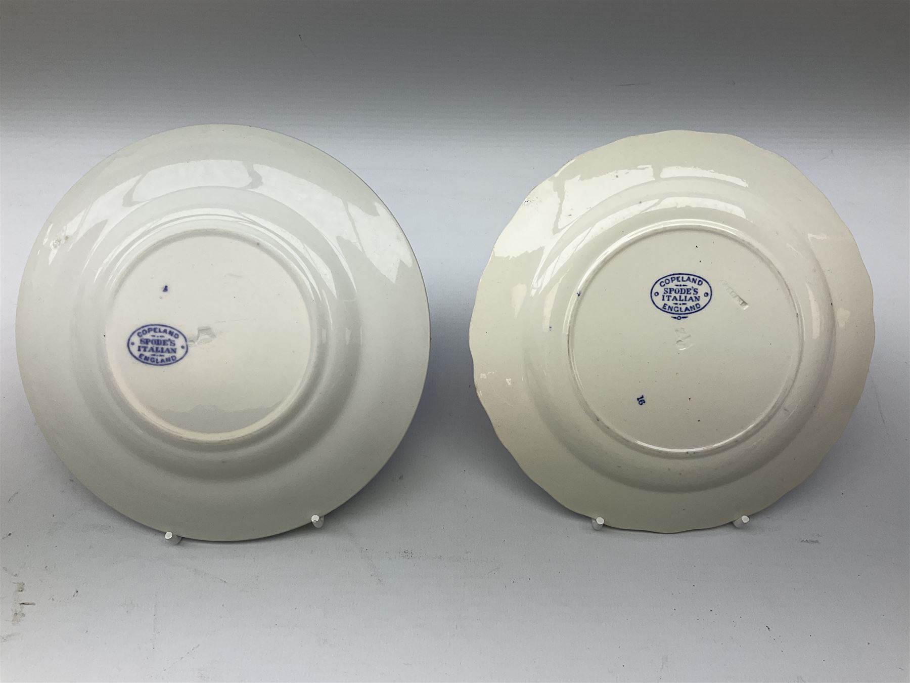 Spode blue and white Italian pattern dinner and tea wares, comprising five dinner plates, four side plates, seventeen side plates, four bowls, ten tea cups and twenty one saucers, five coffee cans and six saucers, and a flan dish, with blue and black printed marks beneath 