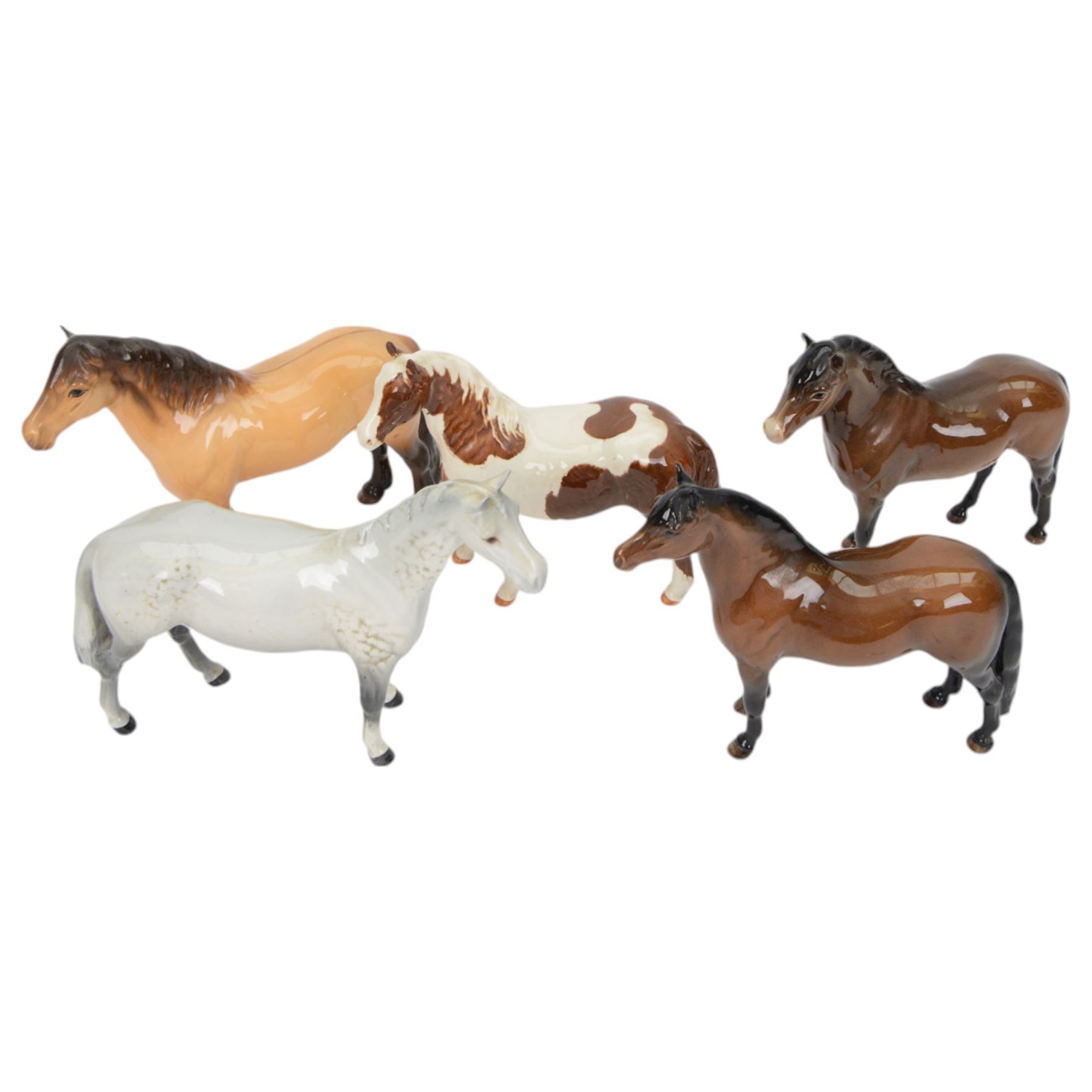 Five Beswick horses, including Skewbald Pinto no 1373, Dartmoor 1642, Dunn Highland no 1644 etc
