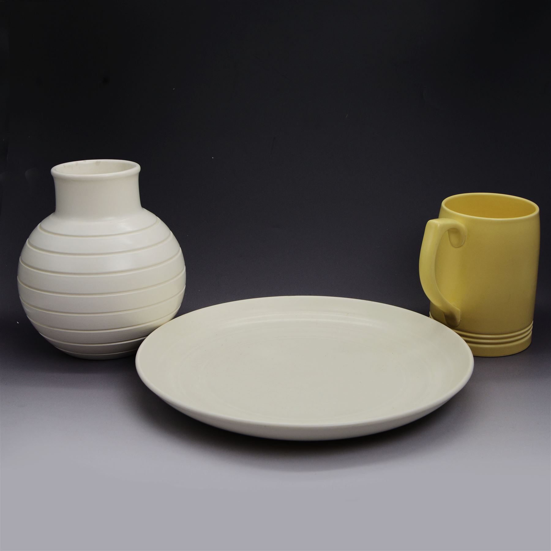 Keith Murray for Wedgwood, ribbed globe vase, together with a plate and tankard, all with printed marks beneath, vase H17cm 