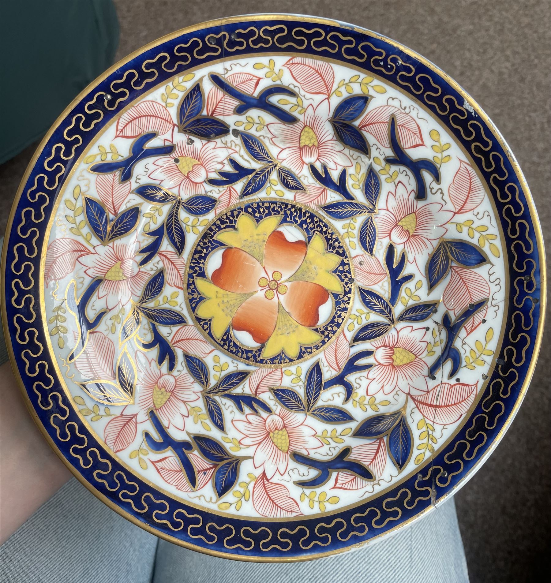 English porcelain Imari tea and coffee wares, pattern 1277, decorated with central orange floral motif surrounded by sprigs of yellow foliage within blue borders, comprising eleven teacups, eight coffee cups, twelve saucers, two shallow bowls and one finger bowl