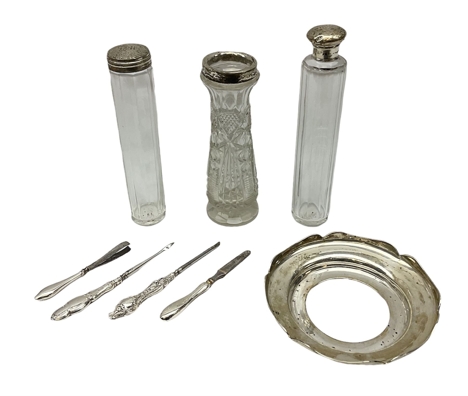 1920's silver stand, hallmarked Birmingham 1922, together with two tall faceted clear glass dressing table jars with hallmarked silver covers, and cut glass vase with hallmarked silver mounted collar, and small group of silver handled accessories, including files, picks, etc., approximate total silver weight 58.8 grams