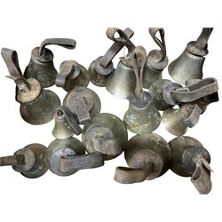 Collection of 44 late 19th century brass church/musical handbells with leather straps by James Shaw Brothers of Bradford and bells marked G.W. possibly cast by the George Welch bell foundry, London.
The number of bells and stated notation, some at different pitch, is as follows;
5 “C”, 4 “D”, 5 “E”, 4 “F”, 5 “G”, 5 “A”, 6 “B”.
3 “F#”, 4 “C#”,1 “Db”, 1 “G#”, 1”A#”.
Two of the bells are minus their clappers and one bell has no leather strap.
