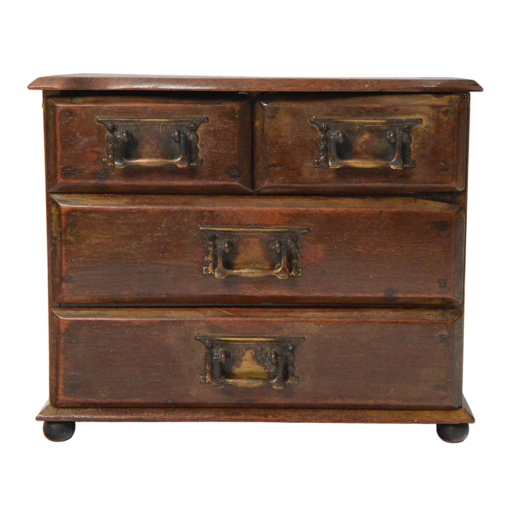 Table top chest of drawers, of rectangular form, with two short and two long drawers, raised upon bun feet, H22cm