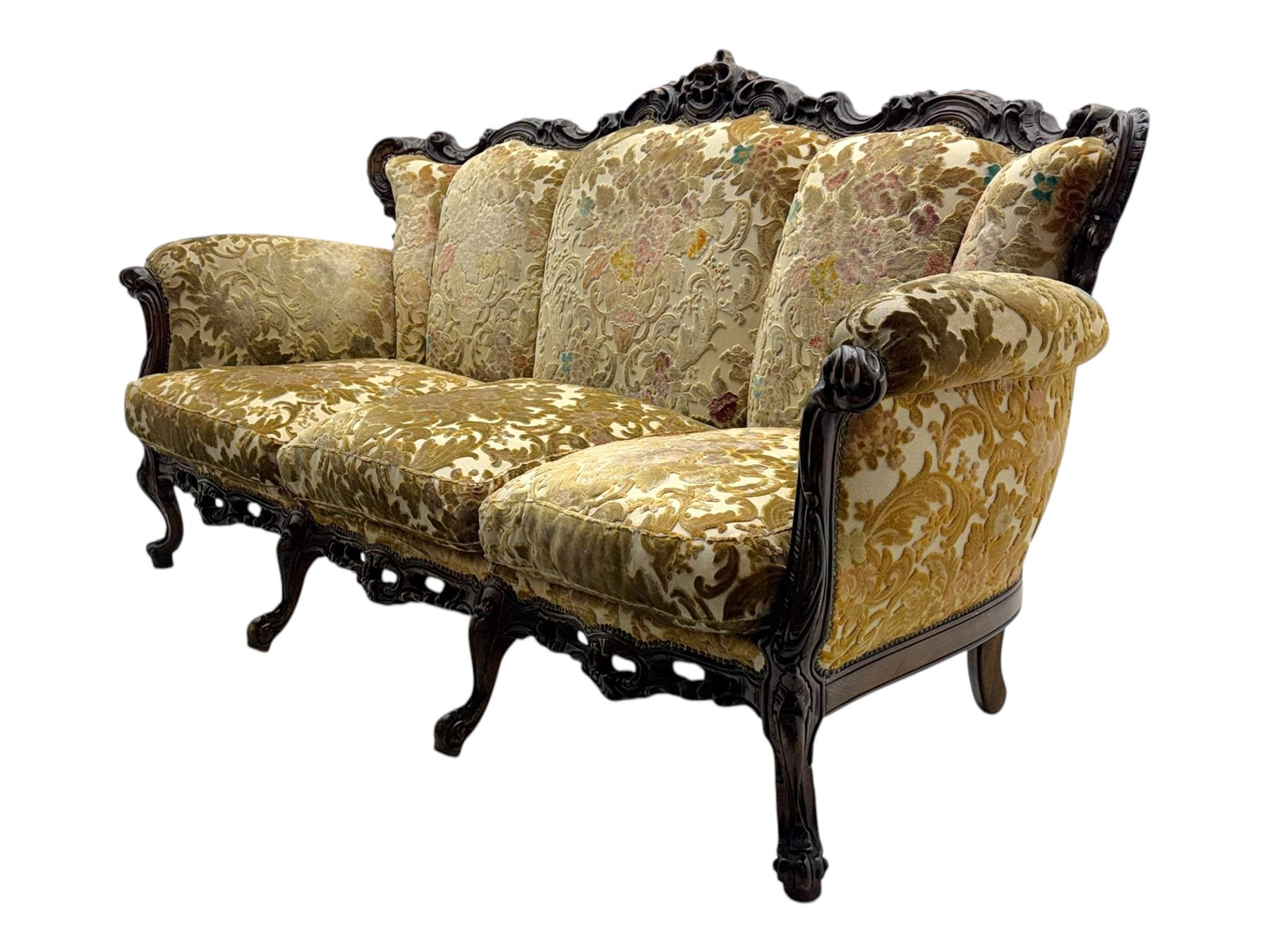 Victorian design stained wood three seater settee, top rail carved and scrolled, padded back and arms, scrolled cabriole feet 