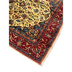 Persian Mahal rug, ivory ground field decorated with floral medallion and interlaced foliate, decorated all over with stylised flower and plant motifs, scrolled repeating triple band border