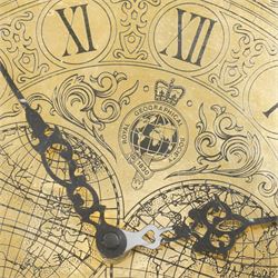Royal Geographic Society - clock occasional table, the inset brass face with double hemisphere design and glazed top, raised on cylindrical supports united by triform platform base