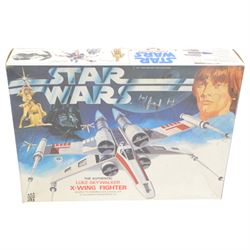 Four Star Wars model kits, comprising AMT ERTL A-Wing Fighter, in sealed packaging, MPC ERTL Return Of The Jedi Millennium Falcon, MPC ERTL Return Of The Jedi X-Wing Fighter and Denys Fisher Luke Skywalker's X-Wing Fighter, all boxed 