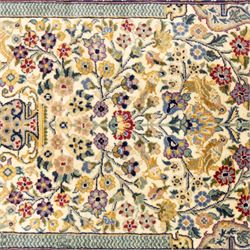 Two Central Persian rugs, ivory ground with a symmetrical foliate and floral design around a shaped cartouche medallion with a red floral and bird motif border with contrasting guard stripes, 142x76cm, Central Persian Kashan rug, crimson central field with a floral and foliate design with a stylized rosette medallion incorporating palmettes and scrolling vine work, enclosed by a dark navy border and multiple guard stripes, 117x68cm, (2)