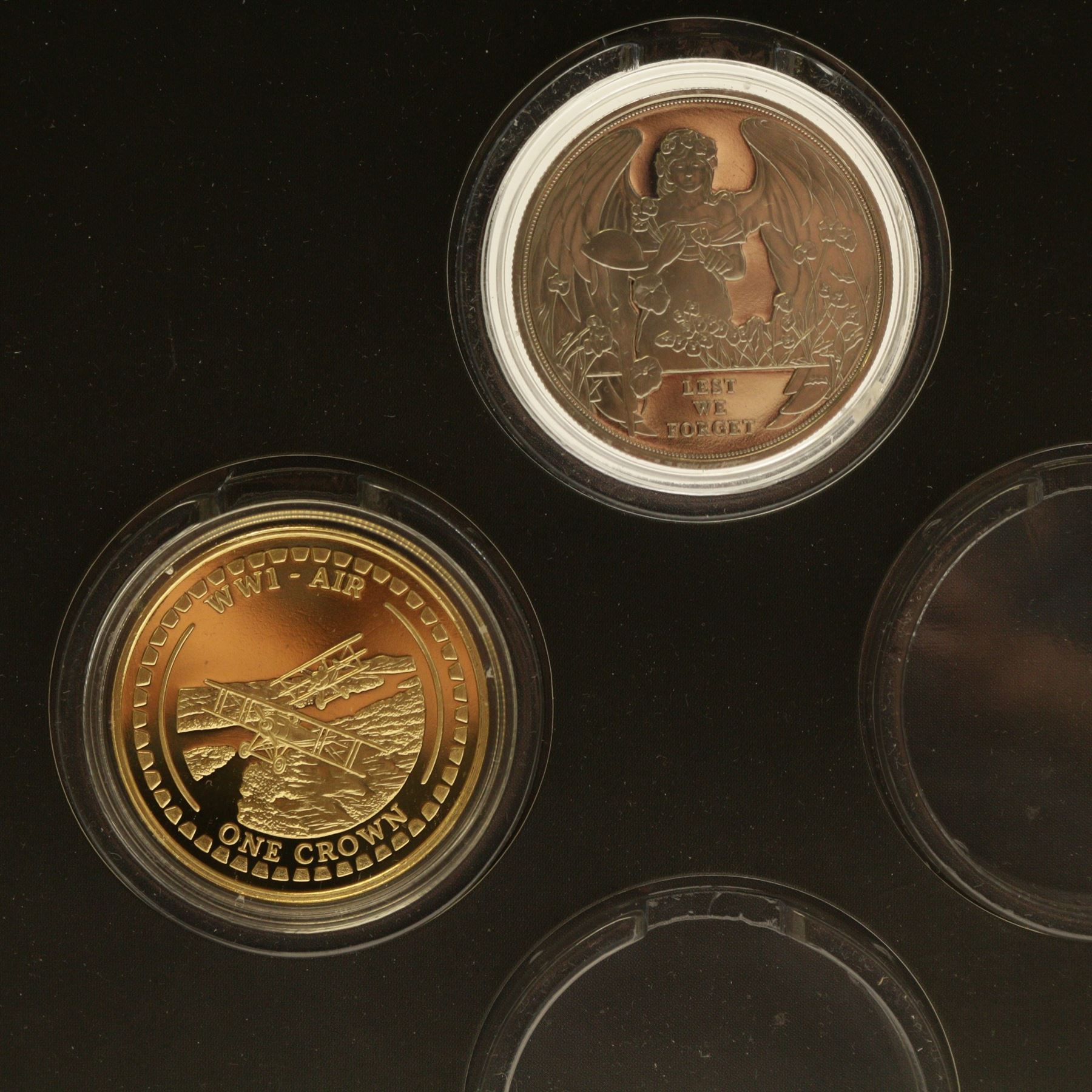 The London Mint Office 'A War To End All Wars', part coin set including Queen Elizabeth II Gibraltar 2017 9 carat gold 10 grams double crown coin etc, in card folder