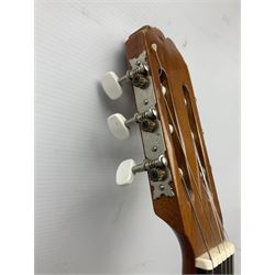 Spanish BM acoustic guitar with mahogany back and sides and spruce top L101cm; in cello carrying case; Roland foot pedal and two Yamaha foot pedals; tin D# organ pipe; folding music stand etc