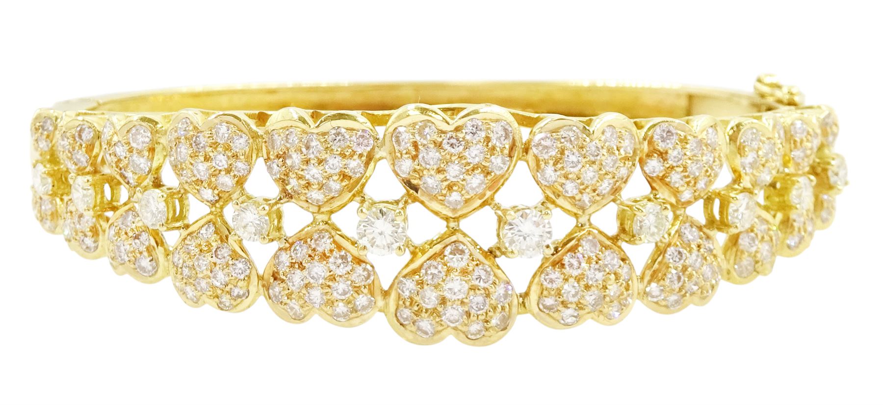 18ct gold diamond heart bangle, two rows of eleven graduating heart motifs, each set with pave set diamonds, spaced by ten round brilliant cut diamonds, total diamond weight approx 1.90 carat