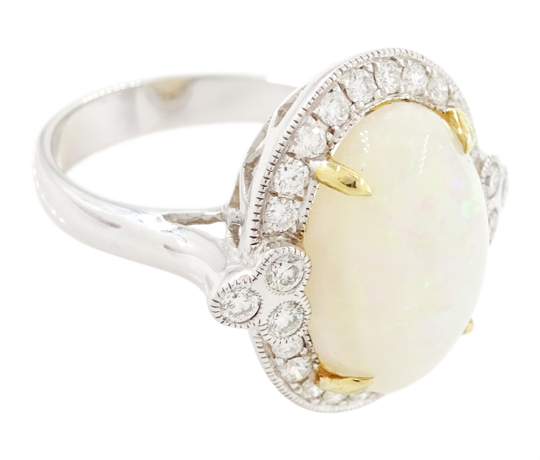 18ct white gold opal and diamond cluster ring, single cabochon cut opal of approx 5.20 carat, surrounded by round brilliant cut diamonds, in a milgrain setting, stamped 750, total diamond weight approx 0.55 carat
