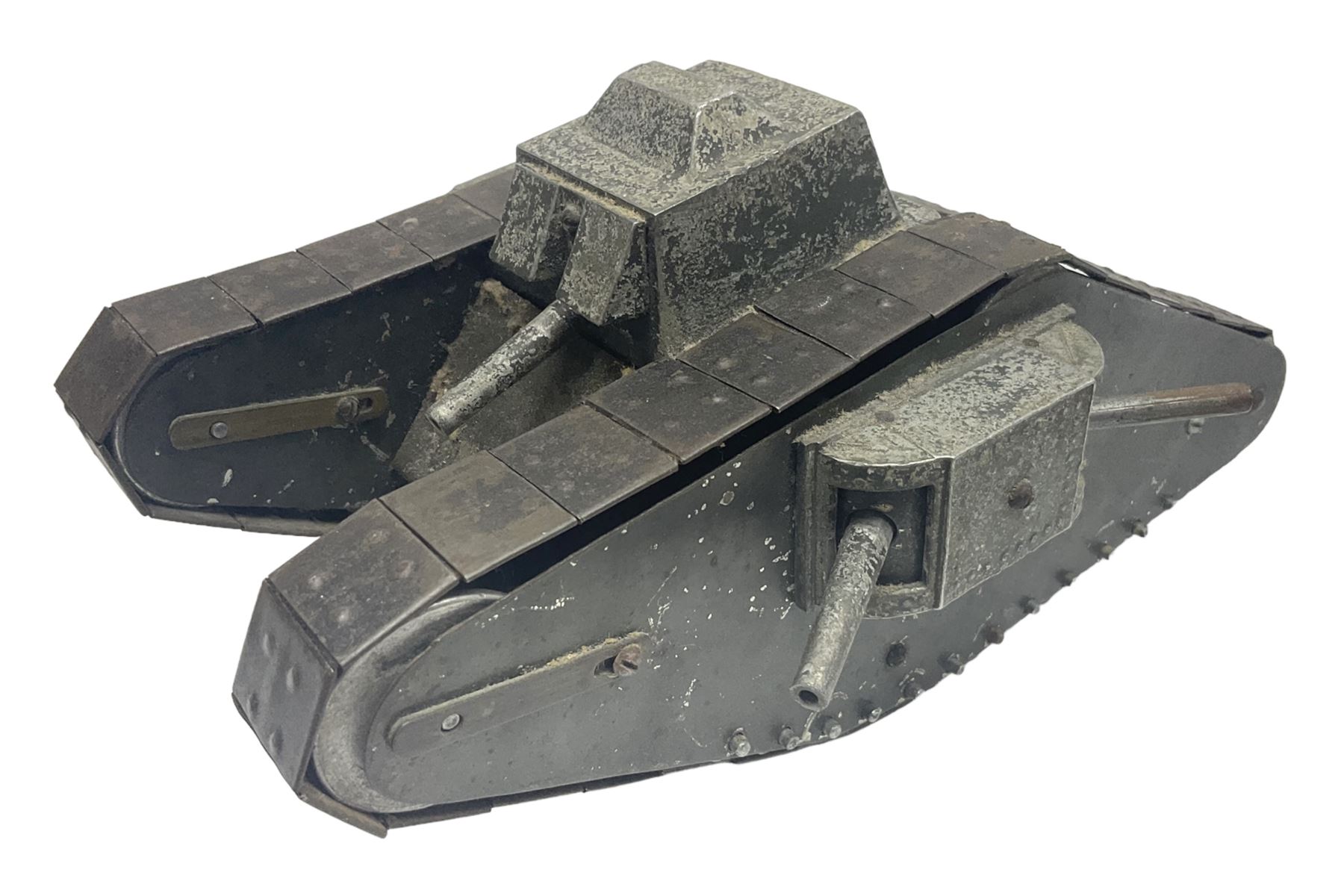 Large clockwork model of a WW1 Tank made of tin-plate and aluminium, with moving side cannons, the clockwork chain driven movement driving the articulated tin tracks; L28.5cms  W16.5cms and H13.5cms