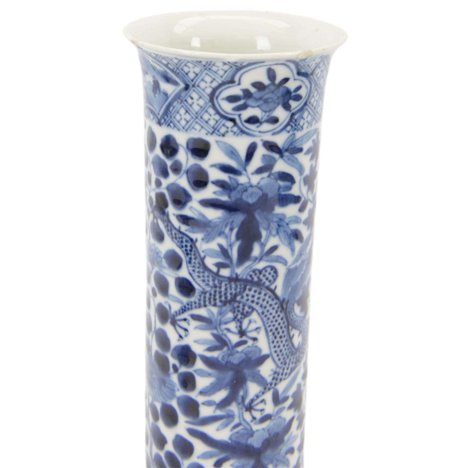 Chinese blue and white vase of cylindrical form, decorated with dragons amongst foliage, together with two other vases 