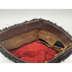 WW2 German small size Balkan style hat with 'SS' metal badges; red cloth top and flash to front with black persianelle type sides; lined in brown card with leather sweatband