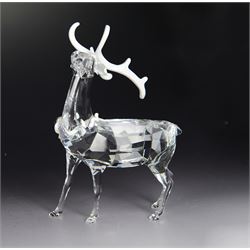 Two Swarovski figures, comprising Doe and Christmas Stag, both in original boxes 
