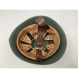 1960s Italian parachutist helmet with liner; camouflage paintwork with parachutist crest to the front