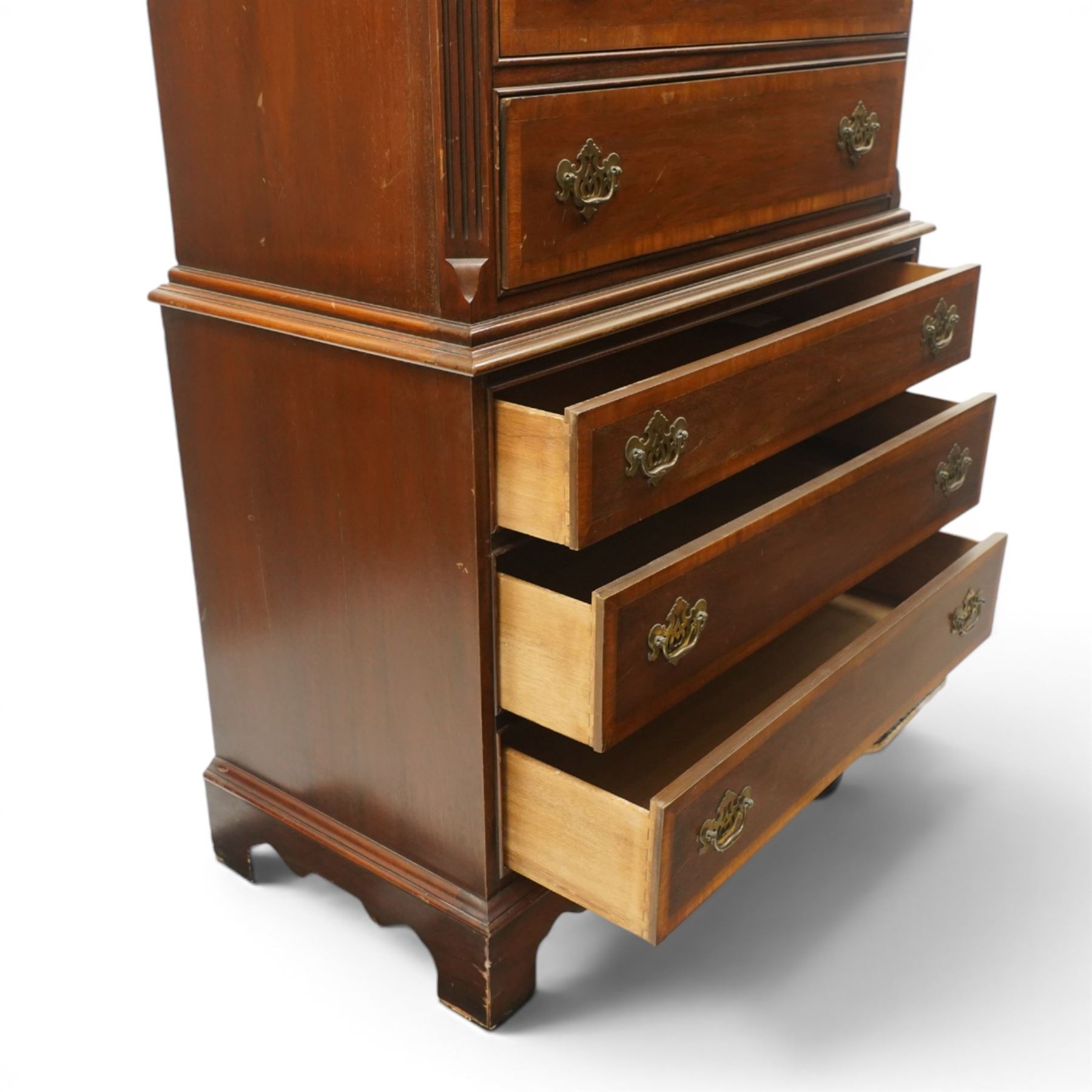 Georgian design mahogany chest on chest, moulded projecting cornice over three short and two long drawers, canted fluted front corners, lower section fitted with three long drawers, brass pierced backplate handles and escutcheons, on shaped bracket feet