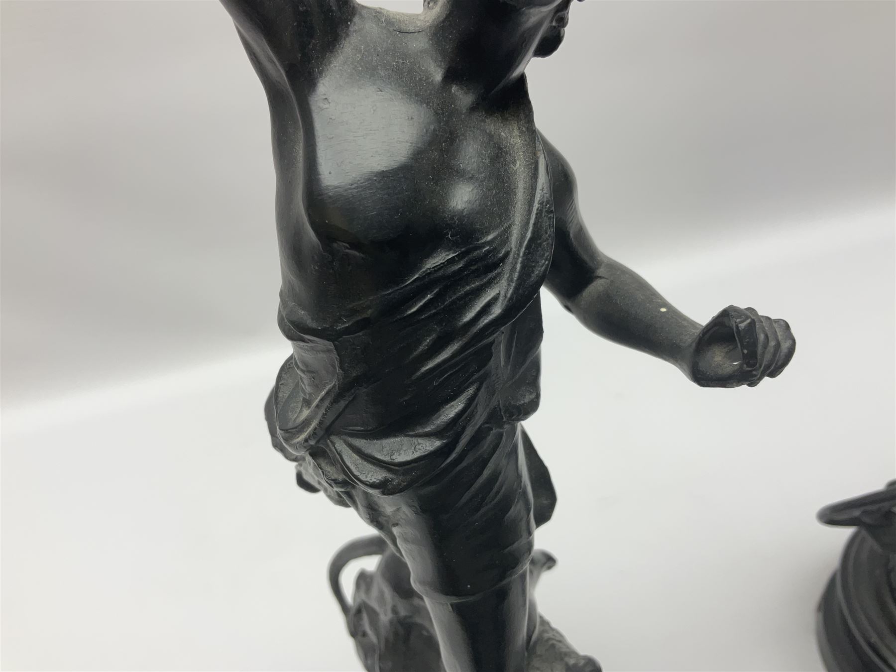 Pair of spelter figures, Le Force and Le Pouvoir, modeled as figures standing on lions, arms held aloft, H51cm 